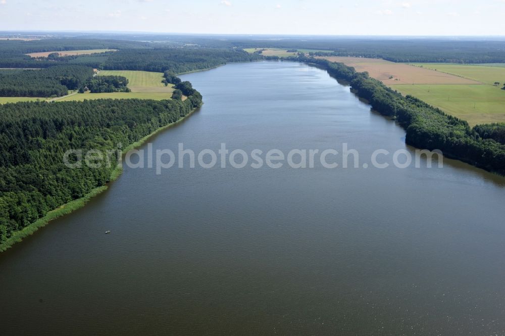 Lenzen from above - View of the lake Rudow near Lenzen in the state of Brandenburg. Rudower Lake is an elongated body of water in the Prignitz in the far northwestern corner of Brandenburg. The lake has two swimming areas - at Lenzen and at the village Leuengarden - as well as a camping ground and is also popular with anglers. Faunisticly, it has a meaning as a bird nesting and roosting area among other things