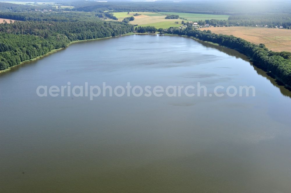 Aerial image Lenzen - View of the lake Rudow near Lenzen in the state of Brandenburg. Rudower Lake is an elongated body of water in the Prignitz in the far northwestern corner of Brandenburg. The lake has two swimming areas - at Lenzen and at the village Leuengarden - as well as a camping ground and is also popular with anglers. Faunisticly, it has a meaning as a bird nesting and roosting area among other things