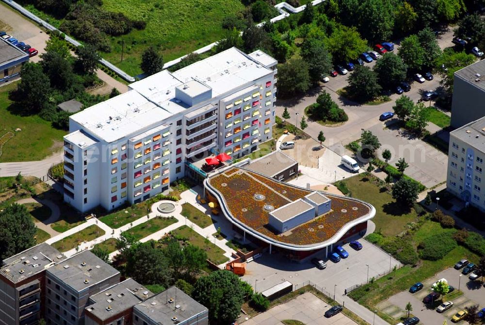 Aerial photograph Magdeburg - Blick auf das sanierte Altenpflegeheim in Magdeburg-Olvenstedt. Das 1986 eingeweihte Altenpflegeheim wurde 2002/2003 für ca. 11 Mio. Euro saniert und im Oktober 2003 wieder eröffnet. Hier leben 144 Bewohner in 120 Zimmern. 70 Pfleger werden hier beschäftigt. Kontakt: Altenpflegeheim Olvenstedt, Johannes-Göderitz-Str. 83, 39130 Magdeburg, Tel.: 0391/72673