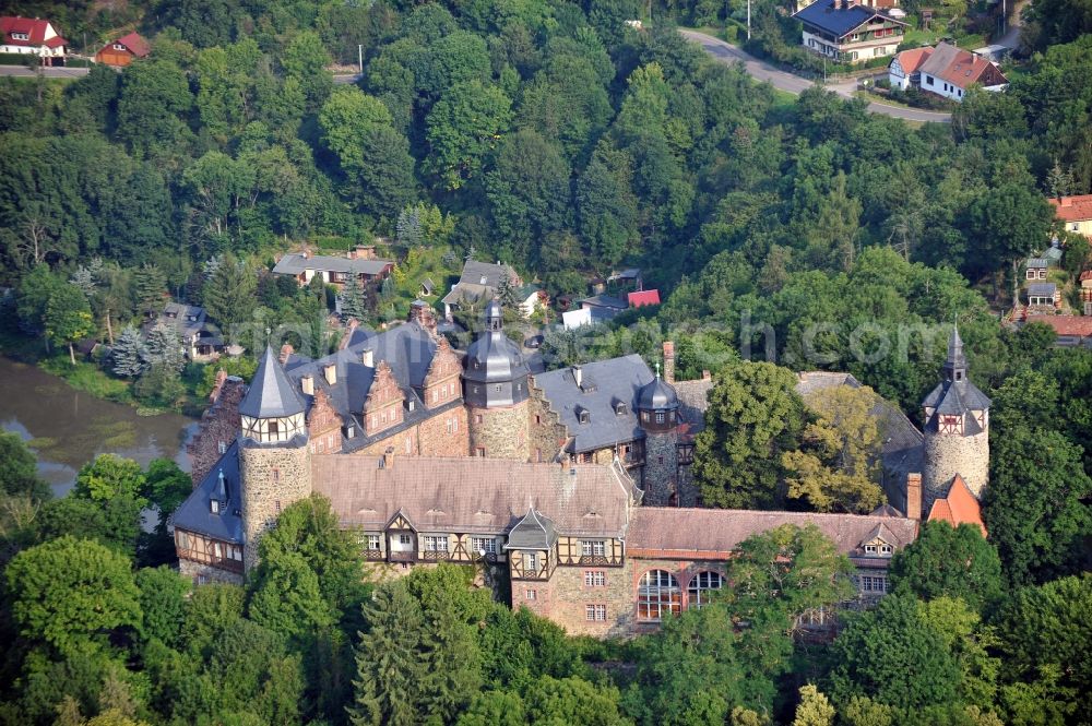 Aerial image Mansfeld - View of the castle Rammelburg in the homonymous district of the town Mansfeld in Saxony-Anhalt. It was built in the 13th Century and was used as a children's home and rehabilitation clinic at the time of the GDR. Today the building is vacant and unused