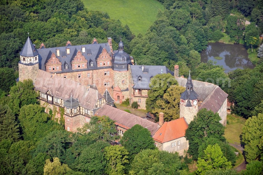 Mansfeld from above - View of the castle Rammelburg in the homonymous district of the town Mansfeld in Saxony-Anhalt. It was built in the 13th Century and was used as a children's home and rehabilitation clinic at the time of the GDR. Today the building is vacant and unused