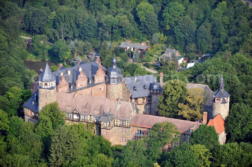 Mansfeld from the bird's eye view: View of the castle Rammelburg in the homonymous district of the town Mansfeld in Saxony-Anhalt. It was built in the 13th Century and was used as a children's home and rehabilitation clinic at the time of the GDR. Today the building is vacant and unused