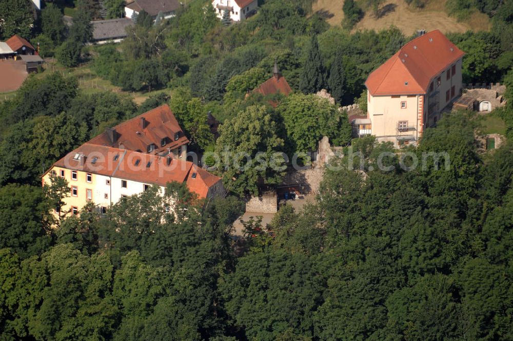 Aerial photograph Reichelsheim - Blick auf das Schloss Reichenberg in Reichelsheim im Odenwald. Das Schloss Reichenberg befindet sich 100 m über dem Ort und 328 m über dem Meeresspiegel. Nach einer Quelle soll die erste Burg von den Herren von Crumpach um 1150 erbaut worden sein. Seit 1994 gehört das komplette Schloss der Offensive Junger Christen. Diese hat die gotische Michaelskapelle restauriert. Die ökumenischen Kommunität nutzt das Schloss als Tagungs- und Begegnungsort und betreibt ein öffentliches Schlosscafe. Kontakt: Gemeindeverwaltung Reichelsheim, Bismarckstraße 43, 64385 Reichelsheim, Tel. (0)6164 508 0, Fax (0)6164 508 33, gemeinde@reichelsheim.de