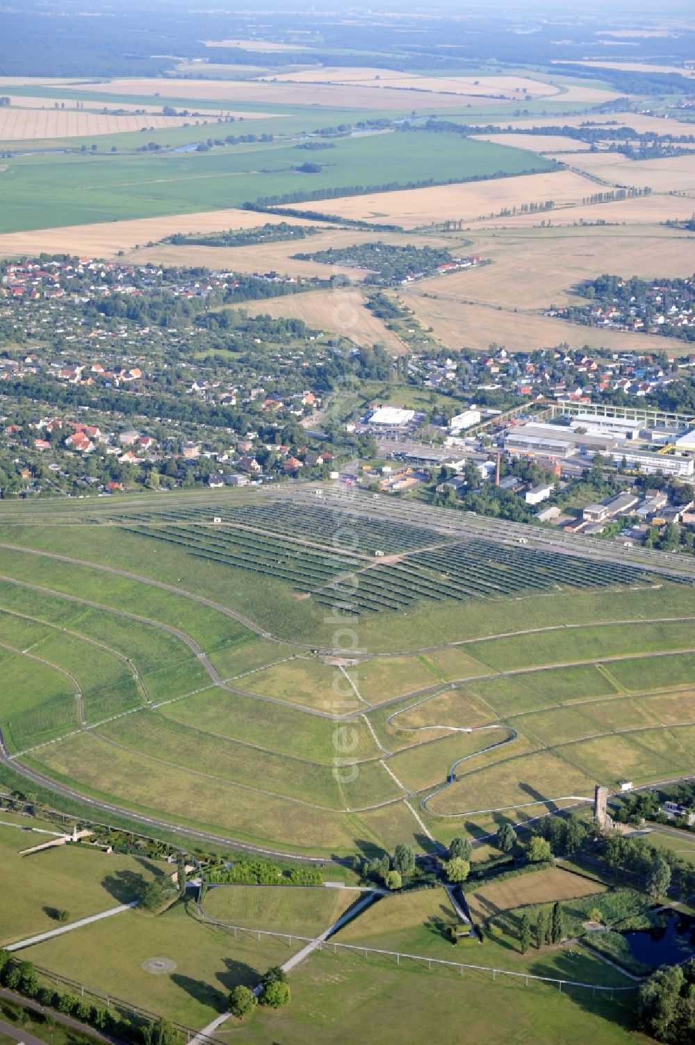 Magdeburg from the bird's eye view: View of the solar park in Magdeburg in Saxony-Anhalt. Under the direction of the WSB group, there was built the solar park within 5 months on the former domestic waste landfill Cracauer Anger, which was closed in 1998. The plant went into operation in December 2011