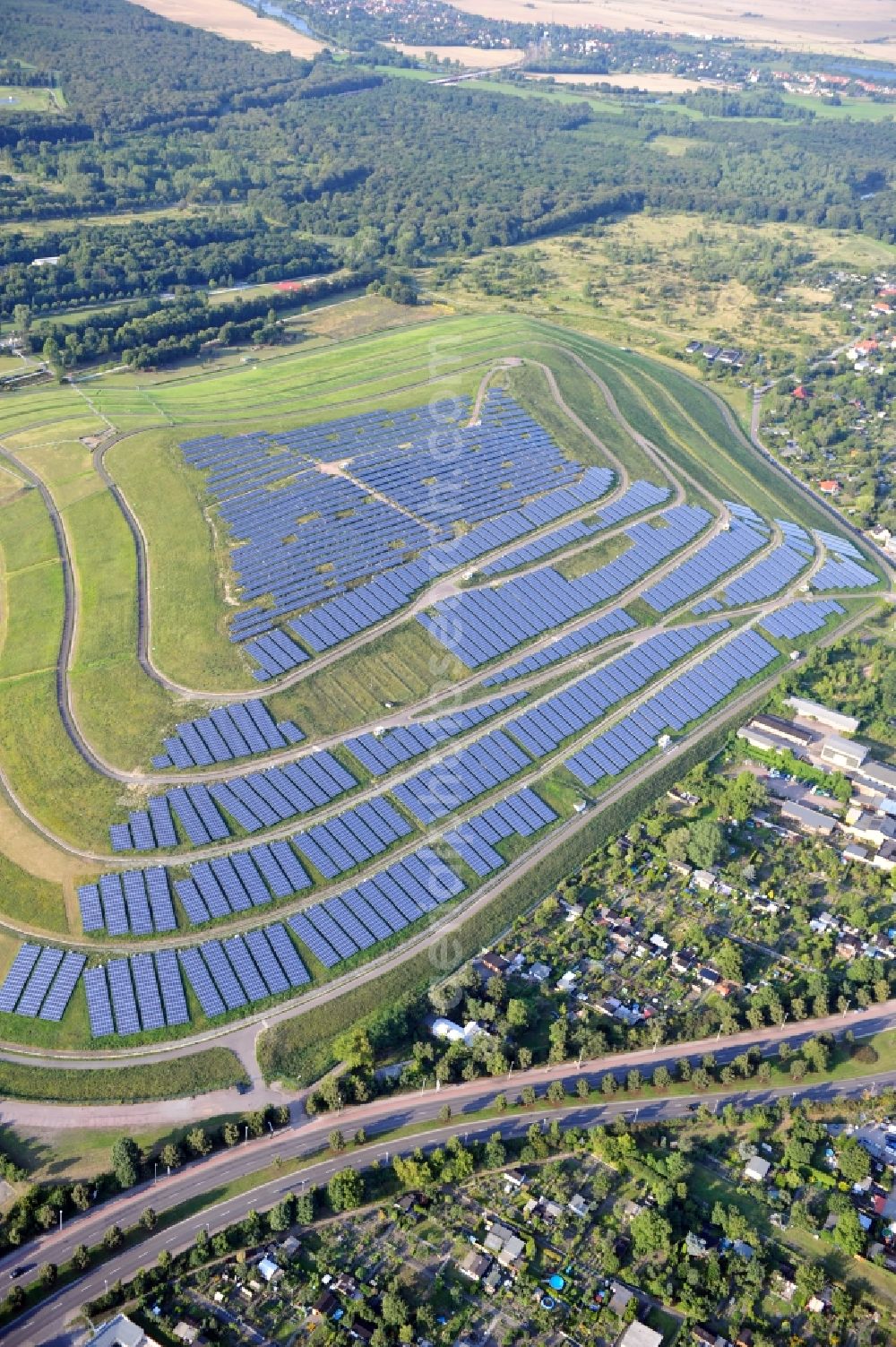 Magdeburg from above - View of the solar park in Magdeburg in Saxony-Anhalt. Under the direction of the WSB group, there was built the solar park within 5 months on the former domestic waste landfill Cracauer Anger, which was closed in 1998. The plant went into operation in December 2011