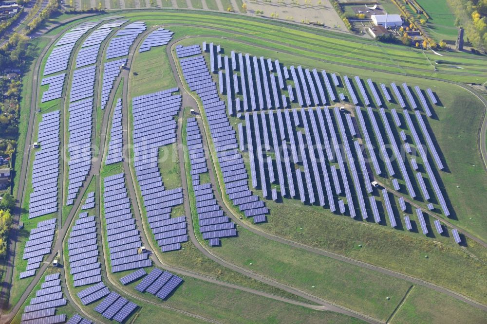 Magdeburg from above - View of the solar park in Magdeburg in Saxony-Anhalt. Under the direction of the WSB group, there was built the solar park within 5 months on the former domestic waste landfill Cracauer Anger, which was closed in 1998. The plant went into operation in December 2011