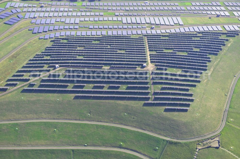 Aerial photograph Magdeburg - View of the solar park in Magdeburg in Saxony-Anhalt. Under the direction of the WSB group, there was built the solar park within 5 months on the former domestic waste landfill Cracauer Anger, which was closed in 1998. The plant went into operation in December 2011