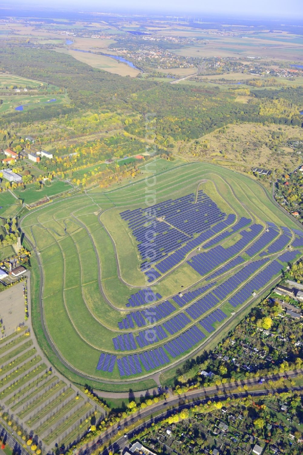 Magdeburg from above - View of the solar park in Magdeburg in Saxony-Anhalt. Under the direction of the WSB group, there was built the solar park within 5 months on the former domestic waste landfill Cracauer Anger, which was closed in 1998. The plant went into operation in December 2011