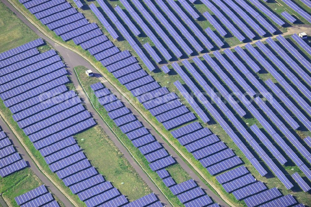 Magdeburg from the bird's eye view: View of the solar park in Magdeburg in Saxony-Anhalt. Under the direction of the WSB group, there was built the solar park within 5 months on the former domestic waste landfill Cracauer Anger, which was closed in 1998. The plant went into operation in December 2011