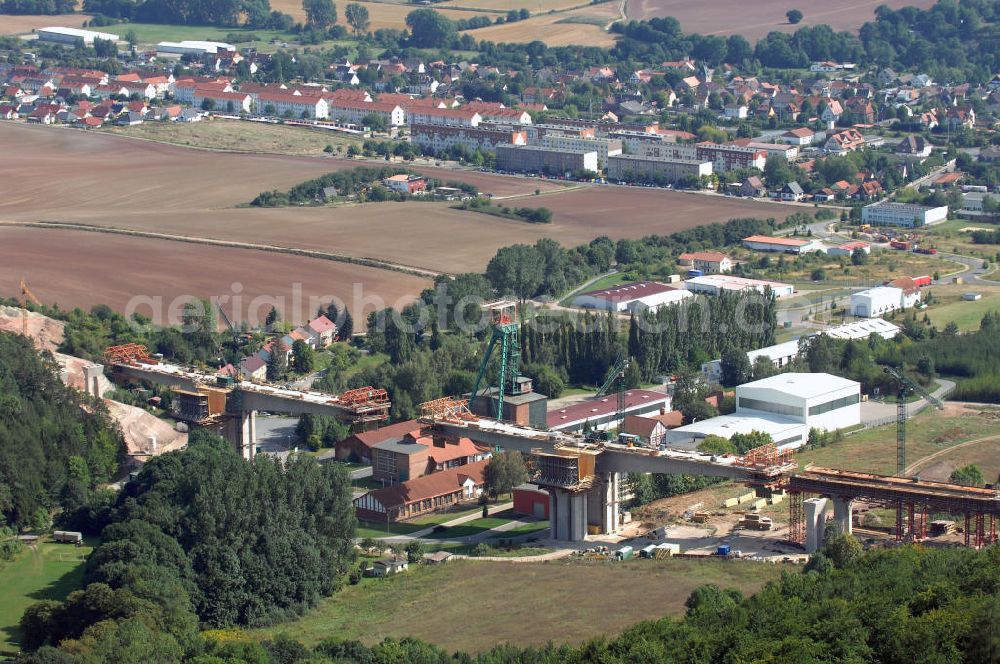 Sollstedt from the bird's eye view: Blick auf Sollstedt und die Baustelle zur Bundesautobahn A38. Sollstedt ist eine Gemeinde, die an den Ausläufern des Südharzes am Rande des Eichsfelds liegt. Momentan wird dort die Bundesautobahn A38 gebaut. Kontakt: Gemeindeverwaltung Sollstedt, Am Markt 2, 99759 Sollstedt, Tel.: +49(0)36338 358 0, Fax: +49(0)36338 60022, Achim Walder: