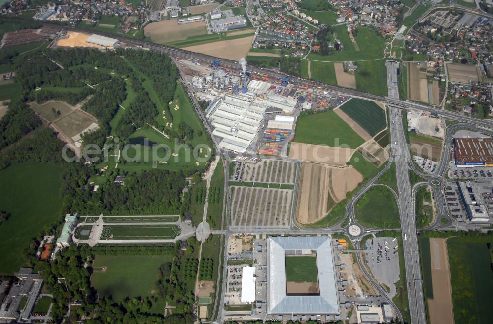 Aerial photograph Salzburg - Das EM Stadion Wals-Siezenheim ist ein 28.900 Zuschauer fassendes Fußballstadion am Stadtrand von Salzburg in der Gemeinde Wals-Siezenheim, und Heimstätte des Fußballverein FC Red Bull Salzburg. Bei der Fußball Europameisterschaft 2008 wird es einer der vier österreichischen Austragungsorte sein. Aus diesem Grund trägt es, neben der Gemeindebezeichnung auch das Kürzel EM im offiziellen Stadionnamen. Eine eventuelle Umbenennung darf erst nach Beendigung der Europameisterschaft 2008 erfolgen. Das Stadion wurde im März 2003 fertiggestellt und gilt als Nachfolger des alten Lehener Stadions in dem von 1971 bis 2003 der Fußballverein Austria Salzburg beheimatet war.