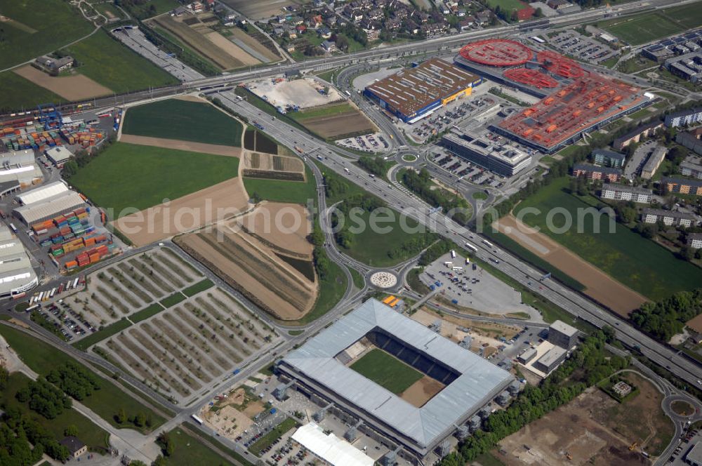 Aerial photograph Salzburg - Das EM Stadion Wals-Siezenheim ist ein 28.900 Zuschauer fassendes Fußballstadion am Stadtrand von Salzburg in der Gemeinde Wals-Siezenheim, und Heimstätte des Fußballverein FC Red Bull Salzburg. Bei der Fußball Europameisterschaft 2008 wird es einer der vier österreichischen Austragungsorte sein. Aus diesem Grund trägt es, neben der Gemeindebezeichnung auch das Kürzel EM im offiziellen Stadionnamen. Eine eventuelle Umbenennung darf erst nach Beendigung der Europameisterschaft 2008 erfolgen. Das Stadion wurde im März 2003 fertiggestellt und gilt als Nachfolger des alten Lehener Stadions in dem von 1971 bis 2003 der Fußballverein Austria Salzburg beheimatet war.