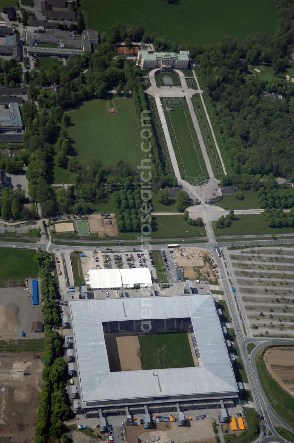 Aerial image Salzburg - Das EM Stadion Wals-Siezenheim ist ein 28.900 Zuschauer fassendes Fußballstadion am Stadtrand von Salzburg in der Gemeinde Wals-Siezenheim, und Heimstätte des Fußballverein FC Red Bull Salzburg. Bei der Fußball Europameisterschaft 2008 wird es einer der vier österreichischen Austragungsorte sein. Aus diesem Grund trägt es, neben der Gemeindebezeichnung auch das Kürzel EM im offiziellen Stadionnamen. Eine eventuelle Umbenennung darf erst nach Beendigung der Europameisterschaft 2008 erfolgen. Das Stadion wurde im März 2003 fertiggestellt und gilt als Nachfolger des alten Lehener Stadions in dem von 1971 bis 2003 der Fußballverein Austria Salzburg beheimatet war.