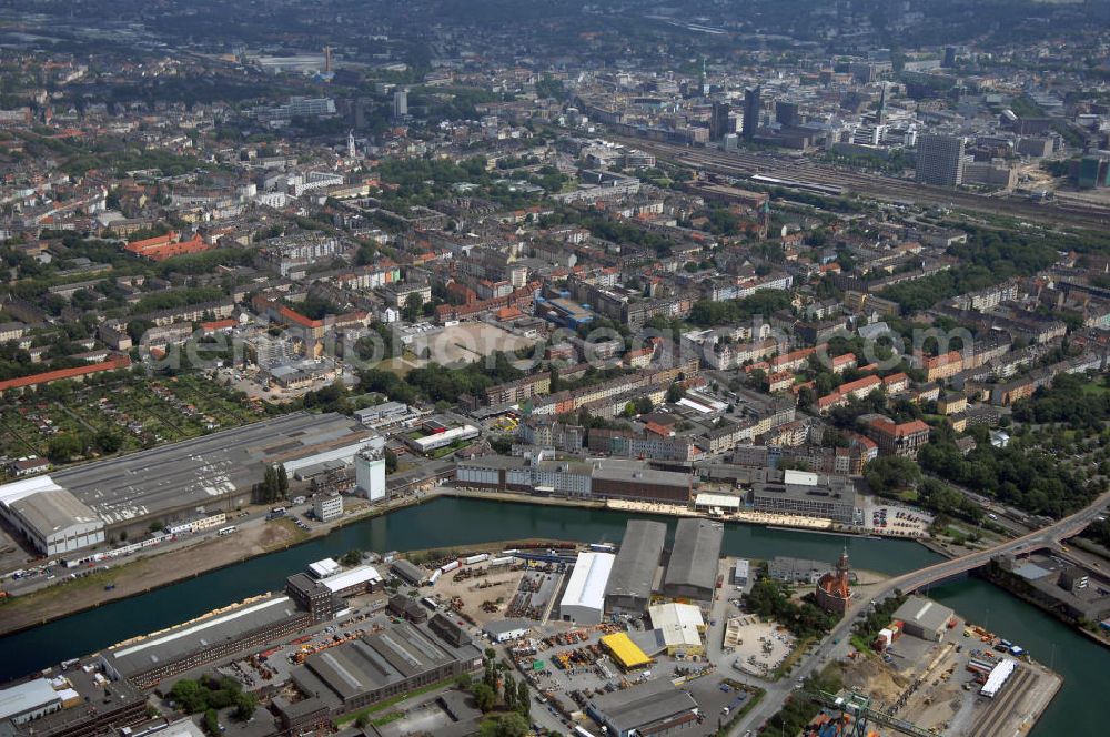 Dortmund from the bird's eye view: Blick auf den Stadthafen und das Alte Hafenamt in Dortmund. Heute finden sich im denkmalgeschützten Gebäude Räumlichkeiten der Wasserschutzpolizei, ein Treffpunkt der Marinekameradschaft Dortmund und das mit der ursprünglichen Ausstattung erhaltene Kaiserzimmer. Die Dortmunder Hafen AG nutzt das Gebäude zudem als Ausstellungsort für die Ausstellung Schifffahrt und Hafen. Kontakt: Dortmunder Hafen AG, Speicherstrasse 23, 44147 Dortmund, Tel. +49 (0)231 98 39 6 81, Fax +49 (0)231 98 39 6 99