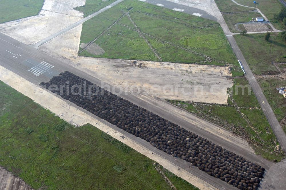 Aerial photograph Cottbus - Blick auf den stillgelegten Flugplatz Cottbus-Nord. Das Gelände wurde bis 2004 von der Bundeswehr genutzt, befindet sich aber inzwischen im Besitz der Stadt Cottbus. Das 35.000 qm große Gelände ist seitdem Planungsfläche. Die gute Lage zur Stadt und die Nähe zur Technischen Uni Cottbus sind ideal für die Schaffung eines Technologie- und Industriepark TIP-Cottbus. Kontakt: Stadtverwaltung Cottbus, Projektgruppe TIP – Cottbus, Neumarkt 5, 03046 Cottbus, Tel. +49 (0)355 612 2080, Fax +49 (0)355 612 2083, egbert.thiele@neumarkt.cottbus.de