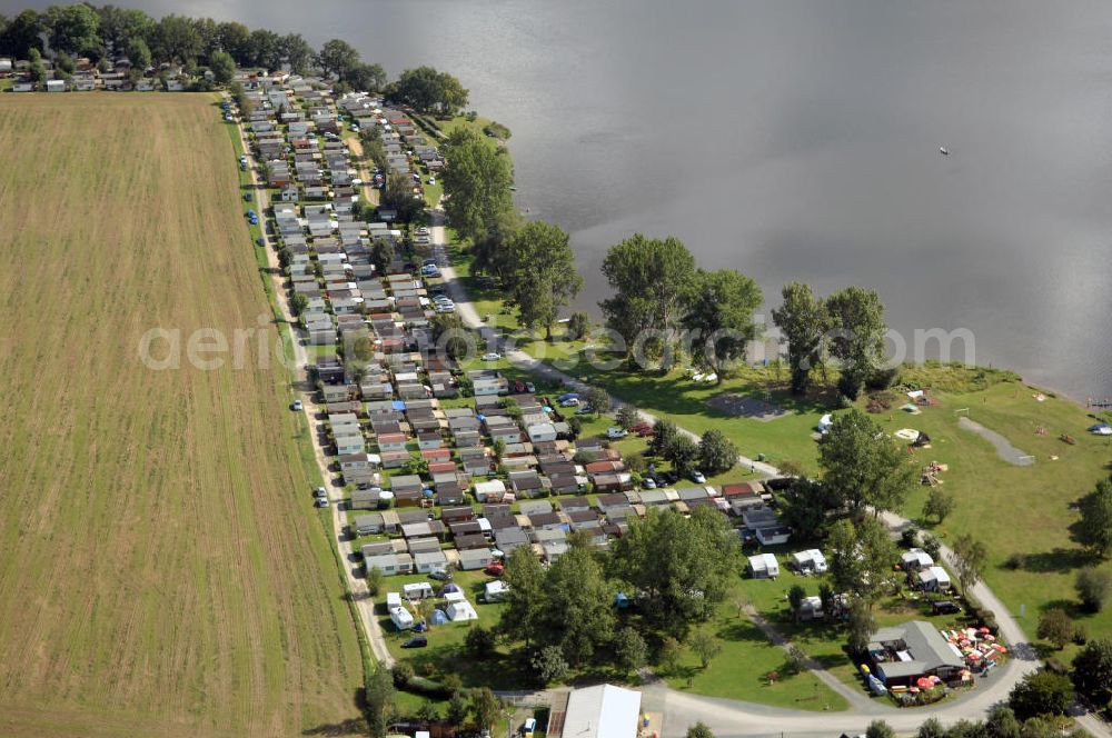 Aerial image Oelsnitz - Blick auf die Talsperre Pirk mit einem Campingplatz. Die Talsperre wurde von 1935 - 1938 erbaut und staut das Wasser der Weißen Elster, der Stausee ist das größte Naherholungsgebiet von Oelsnitz. Kontakt: Naherholung Talsperre Pirk GmbH, Am Strand 4, 08606 Oelsnitz/OT Taltitz, Tel. 037421 23547, Fax 037421 259863, E-Mail info@naherholung-talsperre-pirk.de,