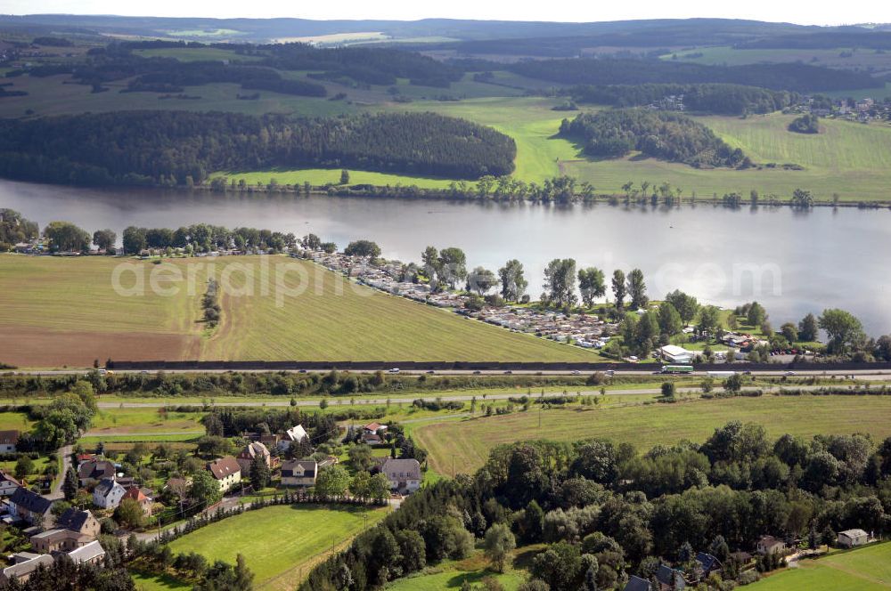 Aerial photograph Oelsnitz - Blick auf die Talsperre Pirk mit einem Campingplatz und der A 72. Die Talsperre wurde von 1935 - 1938 erbaut und staut das Wasser der Weißen Elster, der Stausee ist das größte Naherholungsgebiet von Oelsnitz. Kontakt: Naherholung Talsperre Pirk GmbH, Am Strand 4, 08606 Oelsnitz/OT Taltitz, Tel. 037421 23547, Fax 037421 259863, E-Mail info@naherholung-talsperre-pirk.de,