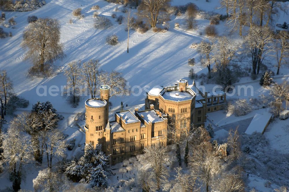 Aerial image Potsdam - Babelsberg - Blick auf das verschneite Schloss Babelsberg im gleichnamigen Park und Stadtteil der brandenburgischen Landeshauptstadt Potsdam, aufgenommen am 05.01.2009. Schloss Babelsberg wurde 1833 als Sommersitz für den späteren Kaiser Wilhelm I. in der Hügellandschaft an der Havel in neogotischen Stil nach Plänen von Karl Friedrich Schinkel errichtet. Das Schloss ist unter der Verwaltung der Stiftung Preußische Schlösser und Gärten Berlin-Brandenburg und steht als Weltkulturerbe innerhalb des Gesamtensembles Potsdam unter dem Schutz der UNESCO.