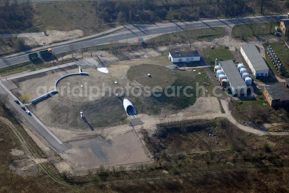 Bitterfeld from the bird's eye view: Blick auf das Wasserzentrum Bitterfeld.Aus dem 1992 stillgelegten Wasserwerk ist in den letzten Jahren ein Informations- und Bildungszentrum entstanden. Aus dem Gedanken, das Bitterfelder Wasserwerk in die Konzeption der Wasserfront mit einzubeziehen und einer öffentlichen Nutzung zuzuführen, entstanden 1996 die Idee für die Nutzung der Anlagen und Gebäude aus den Jahren 1910 bis 1983 durch Umwandlung in ein Wasserzentrum. Zur Umsetzung dieser Idee gründete sich im Jahr 1999 der Trägerverein Wasserzentrum Bitterfeld e.V.Die zwei Wasserspeicher wurden in den letzten Jahren umgebaut, um Ausstellungen, Konzerte und Informationsveranstaltungen durchzuführen.Am 15. Dezember 2006 wurden die umgestalteten Wasserspeicher eingeweiht. Trägerverein Wasserzentrum e.V.,Berliner Straße 6,06749 Bitterfeld, 03493) 512 720, Fax: (03493) 512 721,e-Mail: info@ipg-bitterfeld.de