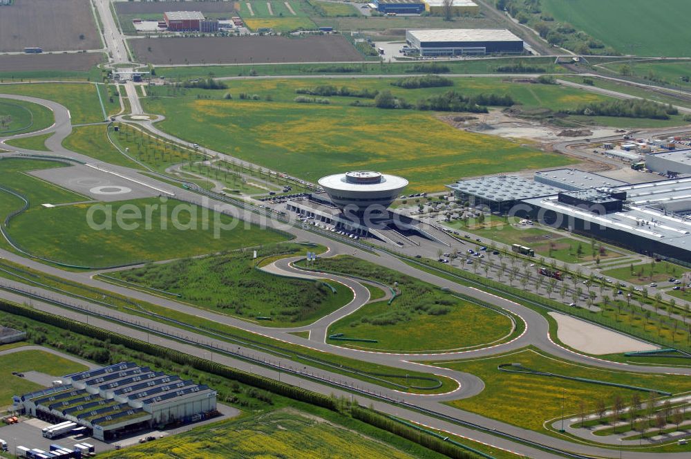 Leipzig from the bird's eye view: Blick auf das Werksgelände Porsche im Leipziger Gewerbegebiet. Im Rahmen eines Auswahlverfahrens wurde im September 1999 Leipzig als neuer Produktionsstandort beschlossen. Das Unternehmen investierte 127,7 Mio Euro und schuf 800 Arbeitsplätze. Kontakt: Porsche Deutschland GmbH, Porschestraße 1, 74321 Bietigheim-Bissingen, Tel. +49 (0)711 911 12250