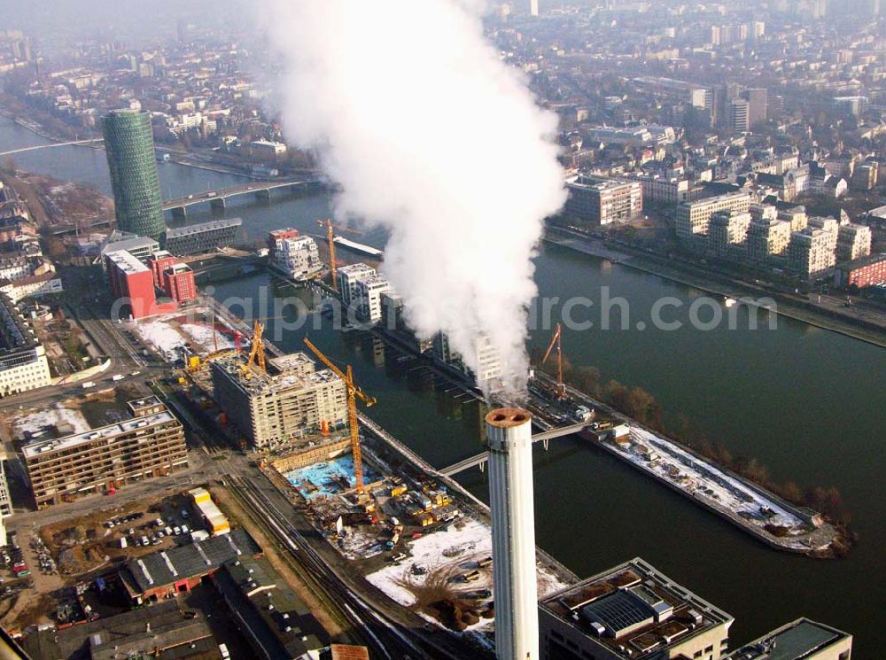 Aerial photograph Frankfurt Main / Hessen - Blick auf den Westhafen .Im Bild zu sehen sind der Westhafen Tower und der Schornstein des Elektrizitätswerks am Westhafen.