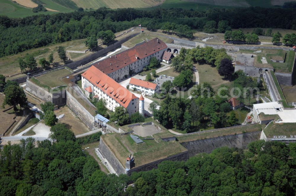 Aerial image Weißenburg - Blick auf die Wülzburg als Ortsteil von Weißenburg. Das Gebäude auf der mit 650 Meter höchsten Bergkuppe der südlichen Frankenalb war ursprünglich ein Benediktinerkloster St. Petrus und Paulus zu Wülzburg. Es wurde 1588 vom Bauherrn Markgraf Georg Friedrich von Brandenburg-Ansbach und -Kulmbach in eine Festung umgewandelt. Seit 1882 ist die Festung in Besitz der Stadt Weißenburg. Im Ersten Weltkrieg wurde die Wülzburg als Kriegsgefangenenlager genutzt, während des Zweiten Weltkrieges war sie ein Internierungslager, danach ein Massen-Flüchtlingslager. Heute beheimatet der Schlossbau u. a. eine Schule mit Internat für soziale Frauenberufe, die inzwischen von den Rummelsberger Anstalten geleitet wird.