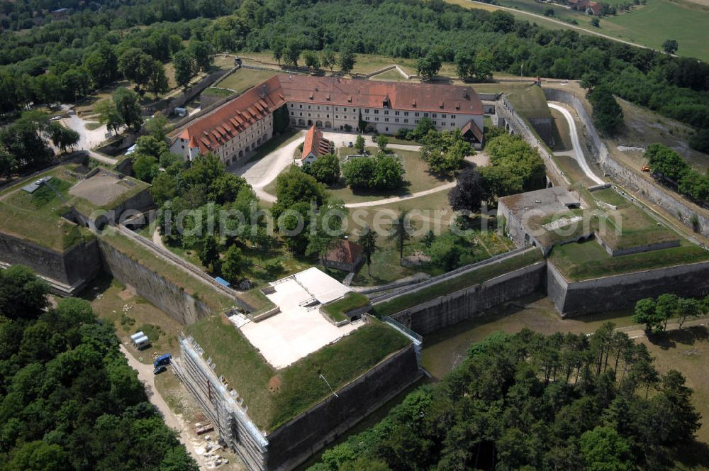 Aerial photograph Weißenburg - Blick auf die Wülzburg als Ortsteil von Weißenburg. Das Gebäude auf der mit 650 Meter höchsten Bergkuppe der südlichen Frankenalb war ursprünglich ein Benediktinerkloster St. Petrus und Paulus zu Wülzburg. Es wurde 1588 vom Bauherrn Markgraf Georg Friedrich von Brandenburg-Ansbach und -Kulmbach in eine Festung umgewandelt. Seit 1882 ist die Festung in Besitz der Stadt Weißenburg. Im Ersten Weltkrieg wurde die Wülzburg als Kriegsgefangenenlager genutzt, während des Zweiten Weltkrieges war sie ein Internierungslager, danach ein Massen-Flüchtlingslager. Heute beheimatet der Schlossbau u. a. eine Schule mit Internat für soziale Frauenberufe, die inzwischen von den Rummelsberger Anstalten geleitet wird.