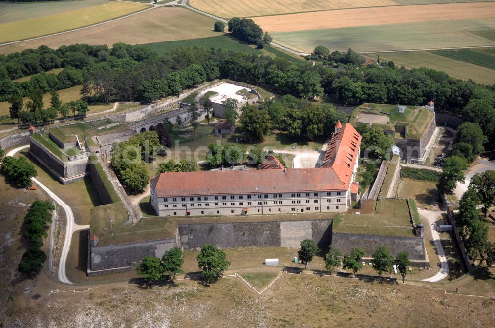 Weißenburg from the bird's eye view: Blick auf die Wülzburg als Ortsteil von Weißenburg. Das Gebäude auf der mit 650 Meter höchsten Bergkuppe der südlichen Frankenalb war ursprünglich ein Benediktinerkloster St. Petrus und Paulus zu Wülzburg. Es wurde 1588 vom Bauherrn Markgraf Georg Friedrich von Brandenburg-Ansbach und -Kulmbach in eine Festung umgewandelt. Seit 1882 ist die Festung in Besitz der Stadt Weißenburg. Im Ersten Weltkrieg wurde die Wülzburg als Kriegsgefangenenlager genutzt, während des Zweiten Weltkrieges war sie ein Internierungslager, danach ein Massen-Flüchtlingslager. Heute beheimatet der Schlossbau u. a. eine Schule mit Internat für soziale Frauenberufe, die inzwischen von den Rummelsberger Anstalten geleitet wird.