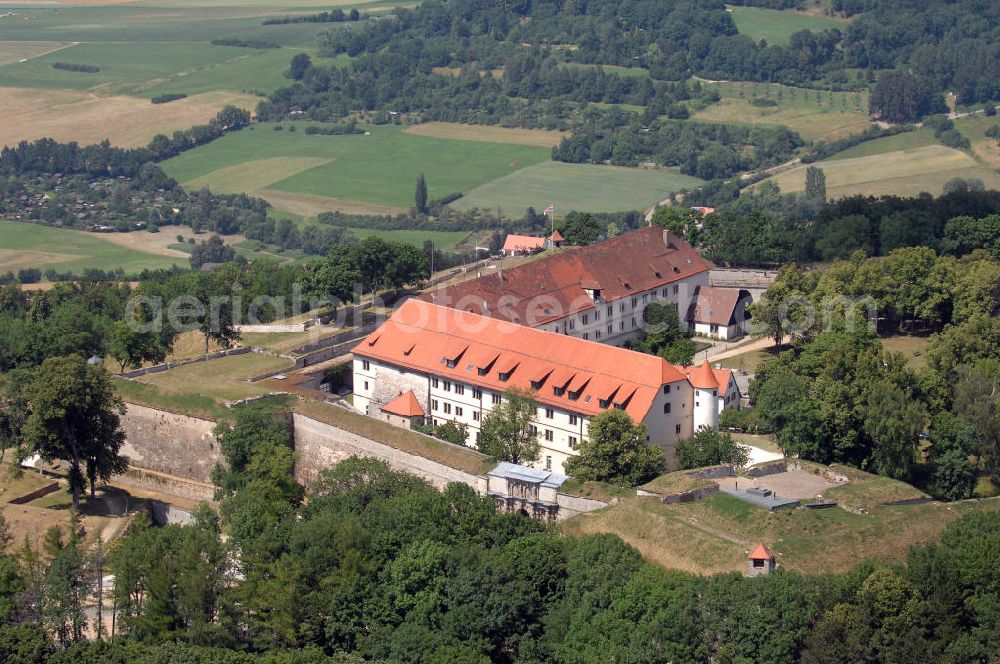 Aerial image Weißenburg - Blick auf die Wülzburg als Ortsteil von Weißenburg. Das Gebäude auf der mit 650 Meter höchsten Bergkuppe der südlichen Frankenalb war ursprünglich ein Benediktinerkloster St. Petrus und Paulus zu Wülzburg. Es wurde 1588 vom Bauherrn Markgraf Georg Friedrich von Brandenburg-Ansbach und -Kulmbach in eine Festung umgewandelt. Seit 1882 ist die Festung in Besitz der Stadt Weißenburg. Im Ersten Weltkrieg wurde die Wülzburg als Kriegsgefangenenlager genutzt, während des Zweiten Weltkrieges war sie ein Internierungslager, danach ein Massen-Flüchtlingslager. Heute beheimatet der Schlossbau u. a. eine Schule mit Internat für soziale Frauenberufe, die inzwischen von den Rummelsberger Anstalten geleitet wird.