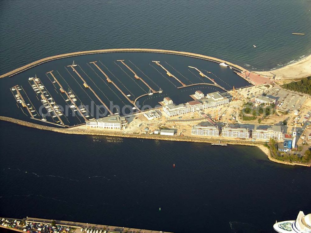 Aerial photograph Rostock - Warnemünde - Der Yachthafen Hohe Düne.750 Motorboote und Yachten bis zu einem Tiefgang von 4 m können im neuen Yachthafen Hohe Düne anlegen. Maritime Service GmbH, Hohe Düne / Am Yachthafen 1-8; D-18119 Rostock-Warnemünde; Fax +49 (0) 381 / 50 40 - 80 99; E-Mail service@yachthafen-hohe-duene.de;