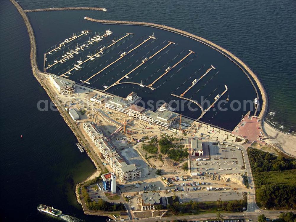 Rostock - Warnemünde from the bird's eye view: Der Yachthafen Hohe Düne.750 Motorboote und Yachten bis zu einem Tiefgang von 4 m können im neuen Yachthafen Hohe Düne anlegen. Maritime Service GmbH, Hohe Düne / Am Yachthafen 1-8; D-18119 Rostock-Warnemünde; Fax +49 (0) 381 / 50 40 - 80 99; E-Mail service@yachthafen-hohe-duene.de;