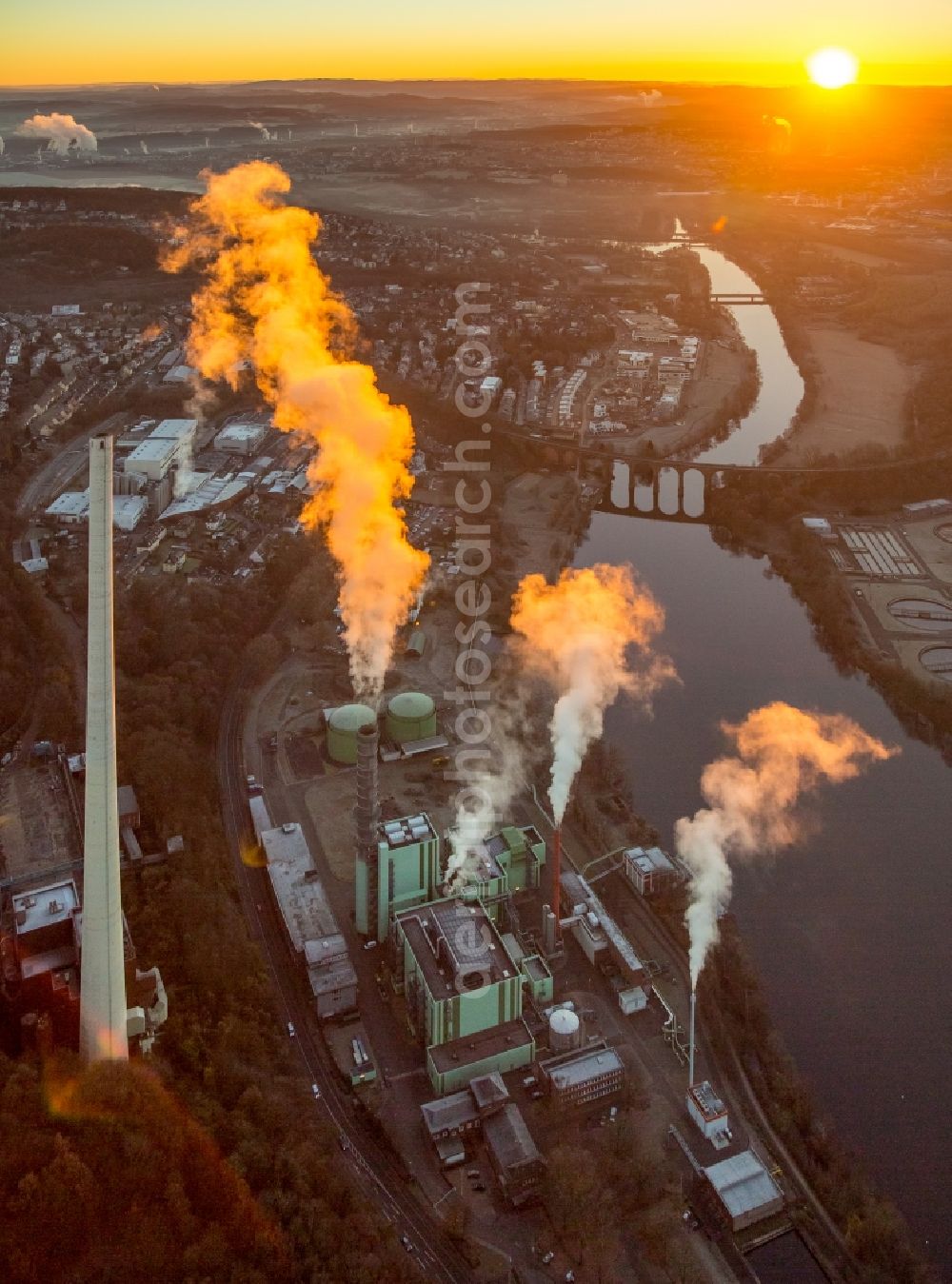 Herdecke from the bird's eye view: Power station plants of the combined heat and power station - regional heat in the light of the sunset in the district Westende in Herdecke in the state North Rhine-Westphalia