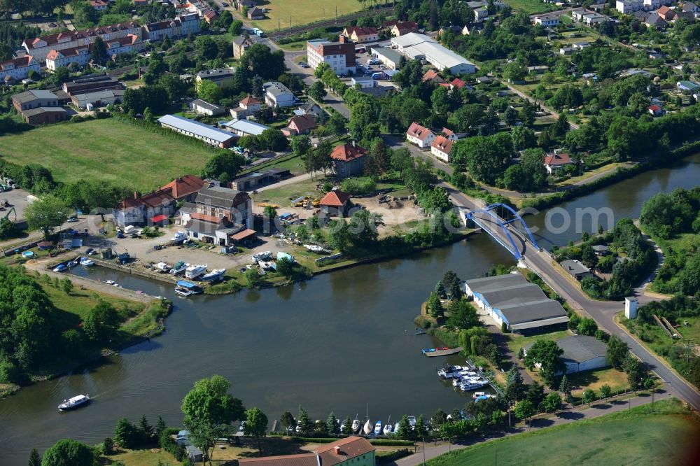 Aerial photograph Burg (bei Magdeburg) - Blumenthal bridge over the Elbe-Havel-Kanal in the North of the town of Burg (bei Magdeburg) in the state of Saxony-Anhalt. The distinct blue arc bridge spans the canal in the North of the town. The bridge is surrounded by a residential area on the edge of the town