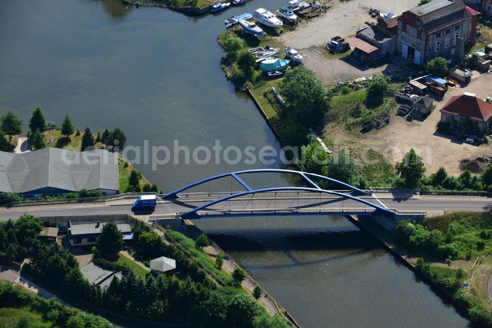 Burg (bei Magdeburg) from the bird's eye view: Blumenthal bridge over the Elbe-Havel-Kanal in the North of the town of Burg (bei Magdeburg) in the state of Saxony-Anhalt. The distinct blue arc bridge spans the canal in the North of the town. The bridge is surrounded by a residential area on the edge of the town