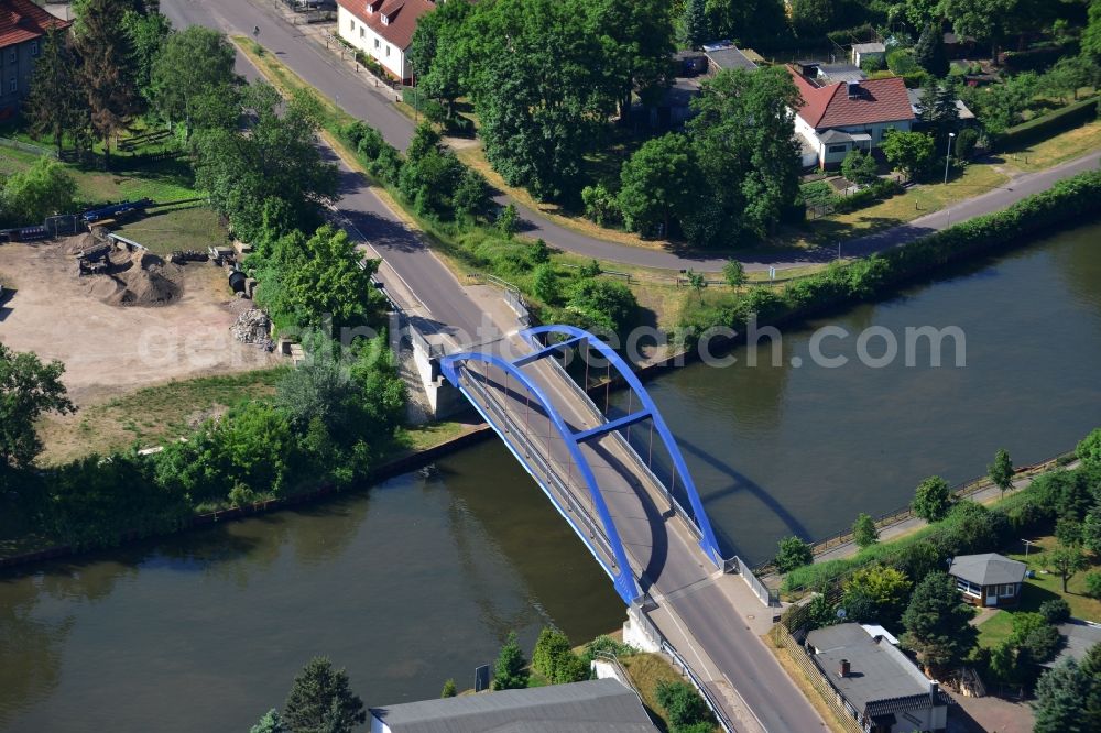 Aerial image Burg (bei Magdeburg) - Blumenthal bridge over the Elbe-Havel-Kanal in the North of the town of Burg (bei Magdeburg) in the state of Saxony-Anhalt. The distinct blue arc bridge spans the canal in the North of the town. The bridge is surrounded by a residential area on the edge of the town