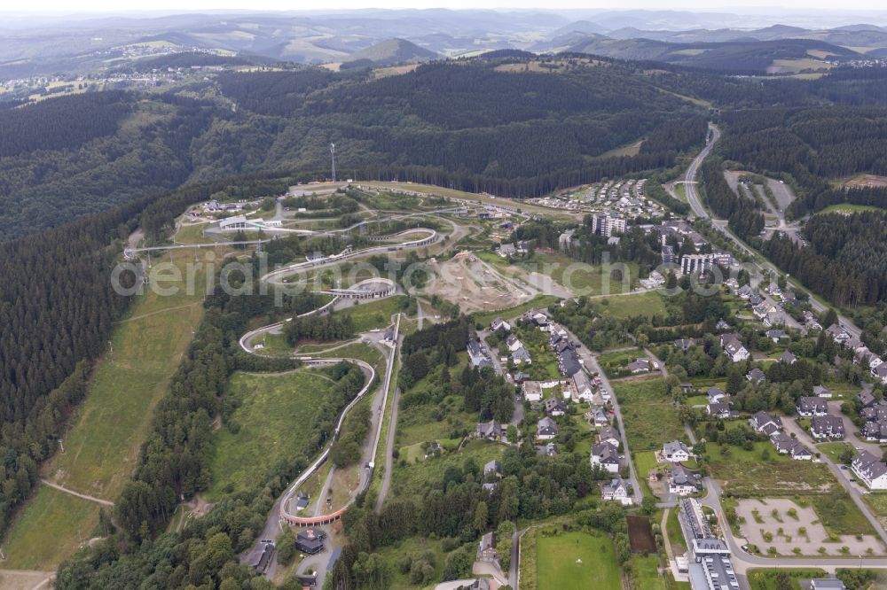 Aerial photograph Winterberg - View at the bobsleigh and luge track in Winterberg in the federal state North Rhine-Westphalia. Operator is the recreation and sports center Winterberg GmbH