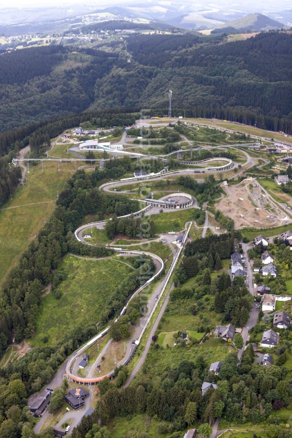 Winterberg from above - View at the bobsleigh and luge track in Winterberg in the federal state North Rhine-Westphalia. Operator is the recreation and sports center Winterberg GmbH