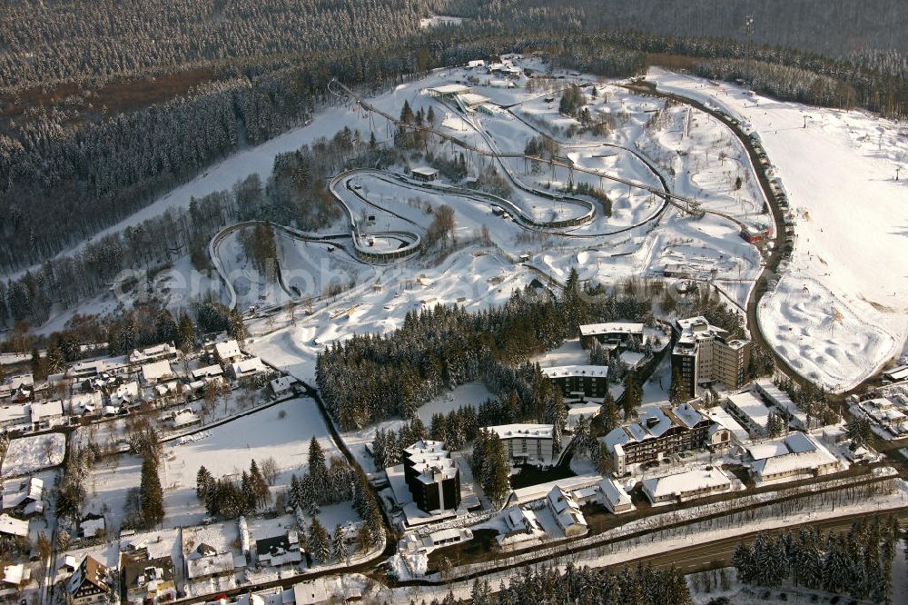 Winterberg from above - Blick auf die winterlich verschneite Bobbahn Winterberg. Die 1609 m lange Kunsteisbahn wird für den Rodel-, Skeleton- und Bob-Sport genutzt. View of the winterly snowy bobsleigh run Winterberg. The 1609 m long ice track is used for the luge, skeleton and bobsled sport.