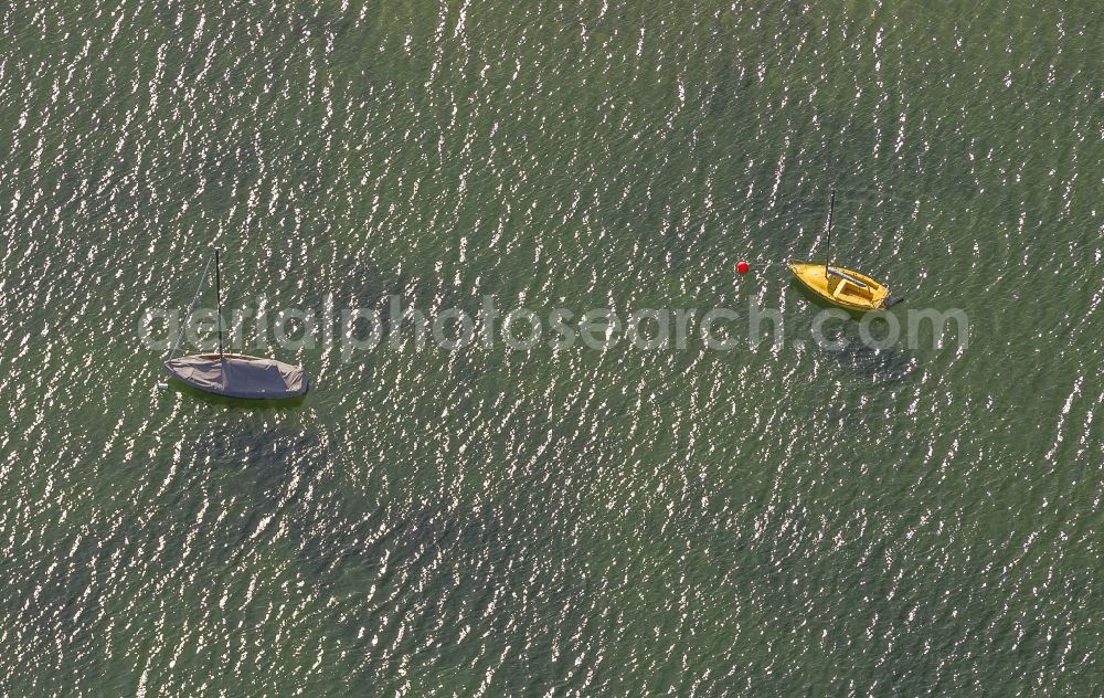 Aerial image Dortmund - Two little sailboats attached to boys on the artificial lake Phoenixsee in Dortmund in the state North Rhine-Westphalia