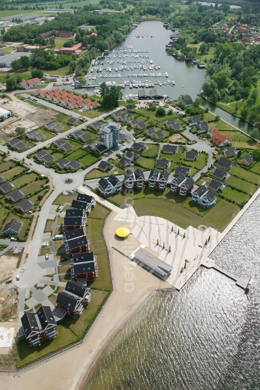 Rechlin from the bird's eye view: Boat mooring in Claassee in Rechlin in Mecklenburg-Vorpommern. In addition to Wolfgang Gerbere boats the docks are also used by the houseboat rental company HAPIMAG