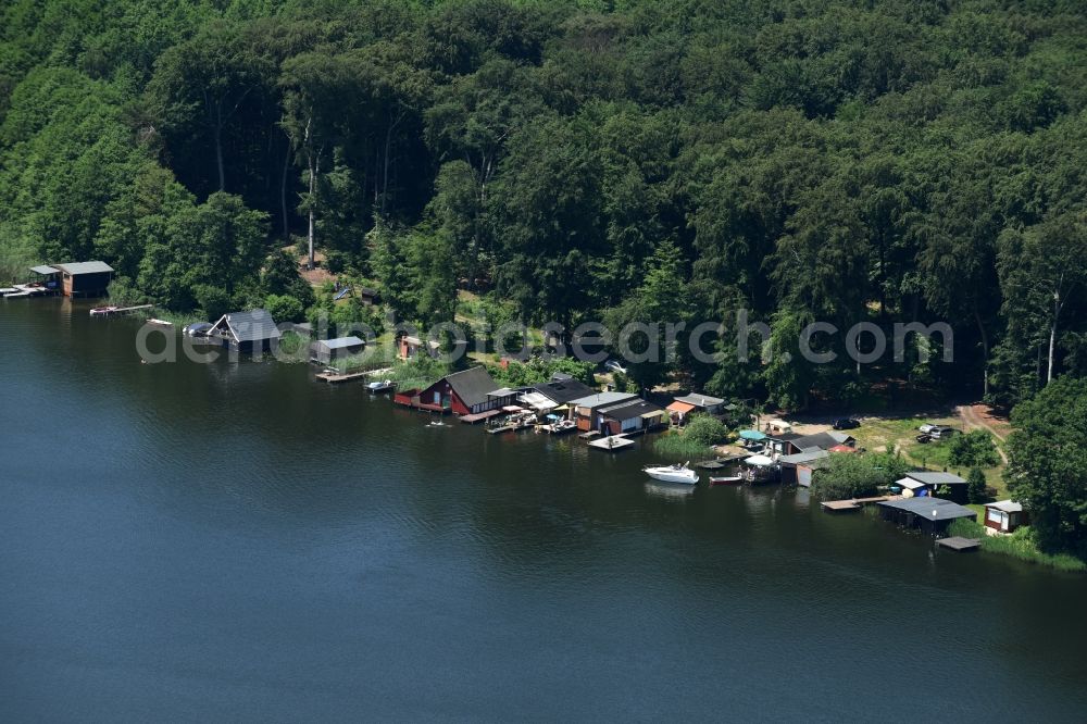 Buchholz from the bird's eye view: Boat House ranks with the recreational boat mooring area on the banks of lake Nebel in Buchholz in the state Mecklenburg - Western Pomerania