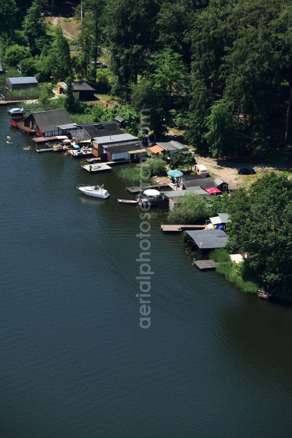 Aerial photograph Buchholz - Boat House ranks with the recreational boat mooring area on the banks of lake Nebel in Buchholz in the state Mecklenburg - Western Pomerania