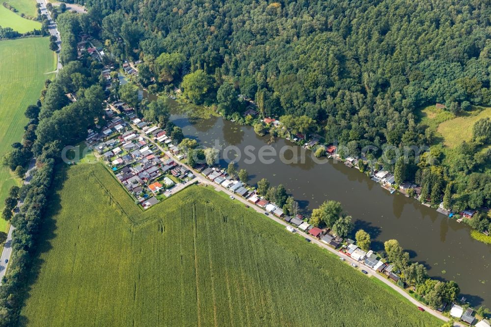 Emmerich am Rhein from the bird's eye view: Boat House ranks with the recreational marine jetties and boat mooring area on the banks of Flusses Die Wild in Emmerich am Rhein in the state North Rhine-Westphalia, Germany