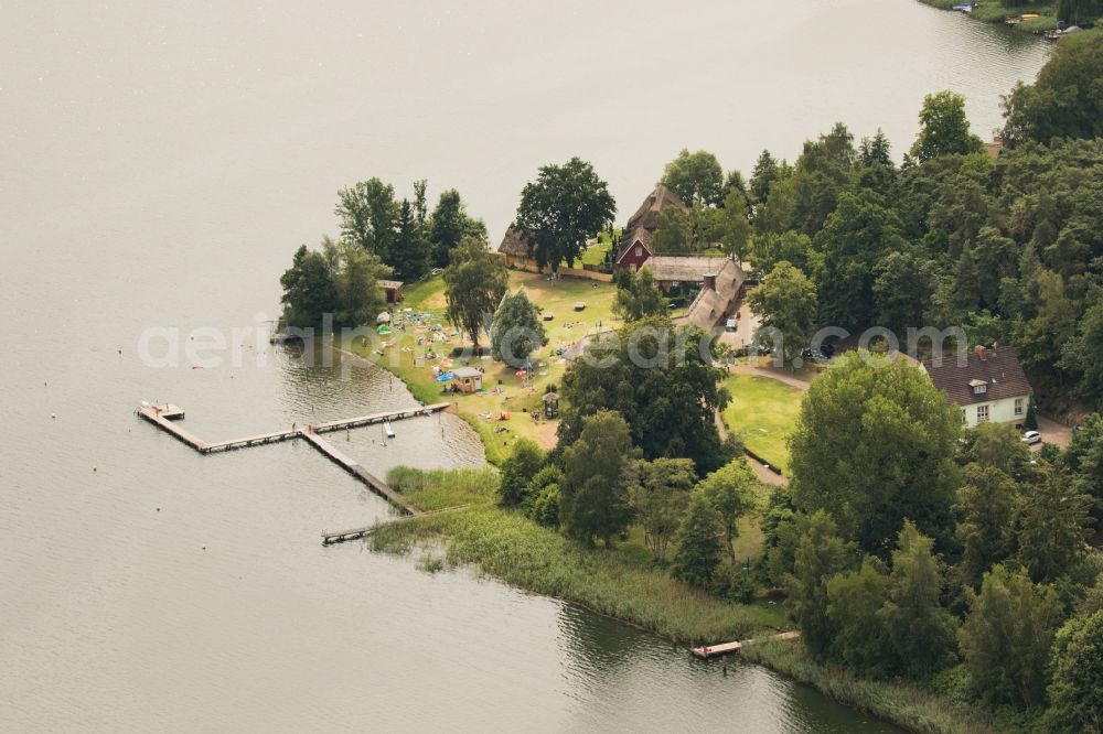 Krakow am See from the bird's eye view: Boat House ranks with the recreational marine jetties and boat mooring area on the banks of lake Krakower See in Krakow am See in the state Mecklenburg - Western Pomerania