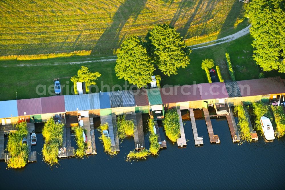 Schillersdorf from above - Boat House ranks with the recreational marine jetties and boat mooring area on the banks of Leppinsee in Schillersdorf in the state Mecklenburg - Western Pomerania, Germany
