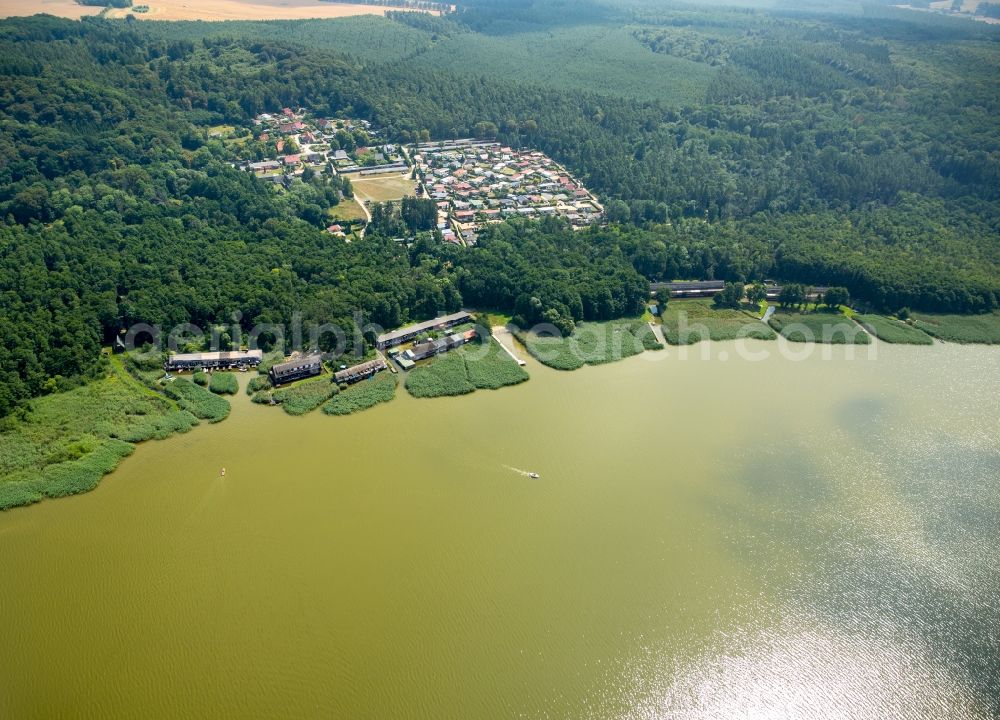 Aerial image Seedorf - Boat House ranks with the recreational marine jetties and boat mooring area on the banks des Malchiner Sees in Seedorf in the state Mecklenburg - Western Pomerania