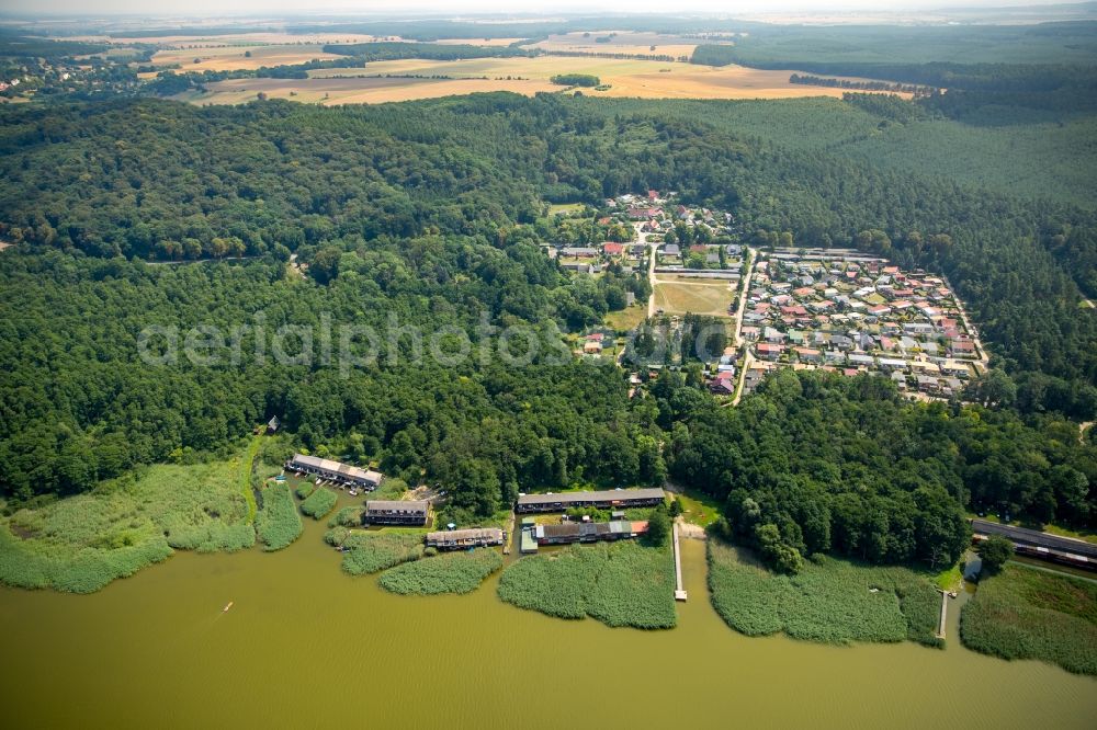 Seedorf from above - Boat House ranks with the recreational marine jetties and boat mooring area on the banks des Malchiner Sees in Seedorf in the state Mecklenburg - Western Pomerania