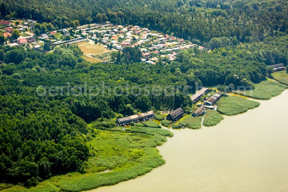 Aerial image Seedorf - Boat House ranks with the recreational marine jetties and boat mooring area on the banks des Malchiner Sees in Seedorf in the state Mecklenburg - Western Pomerania