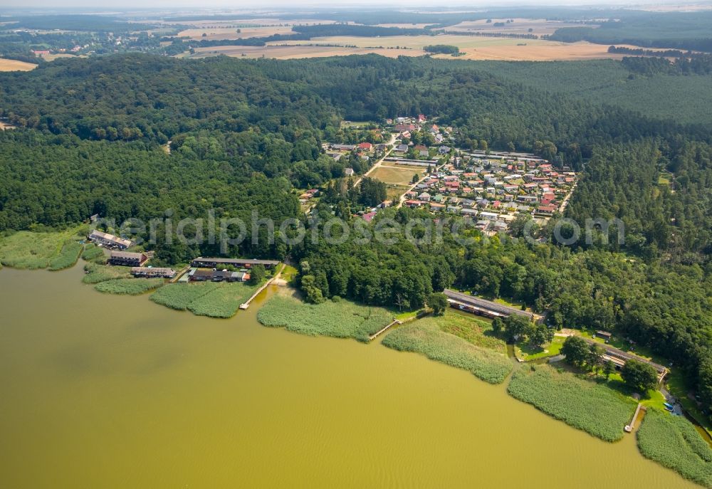 Aerial photograph Seedorf - Boat House ranks with the recreational marine jetties and boat mooring area on the banks des Malchiner Sees in Seedorf in the state Mecklenburg - Western Pomerania