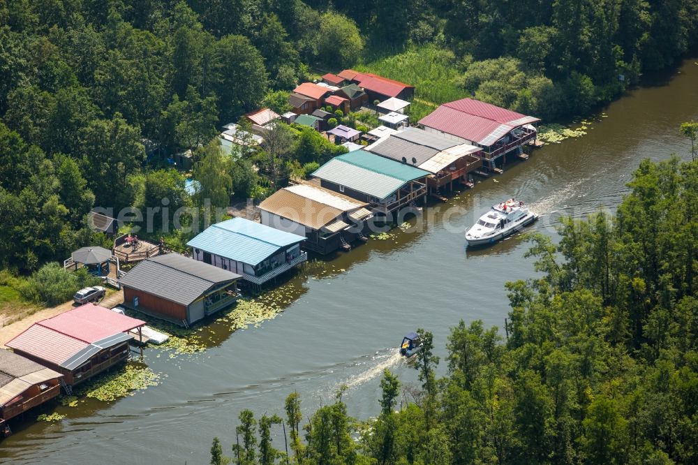 Mirow from the bird's eye view: Boat House ranks with the recreational marine jetties and boat mooring area on the banks of lake Mirower See in Mirow in the state Mecklenburg - Western Pomerania